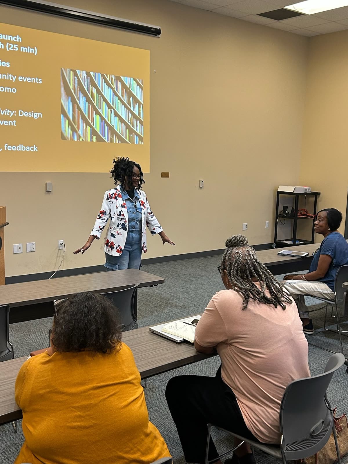 Cara speaking at an author workshop