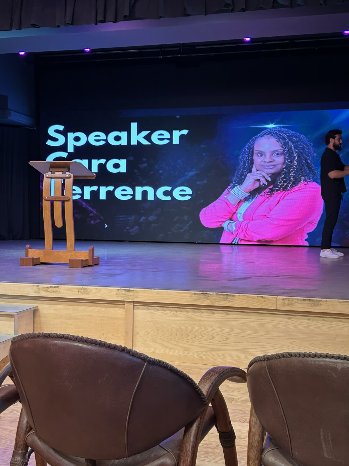 Event screen introducing Speaker Cara Terrance